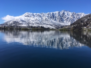 Beautiful snow capped Remarkables Ski Mountain from Million Dollar Cruise Boat in winter.